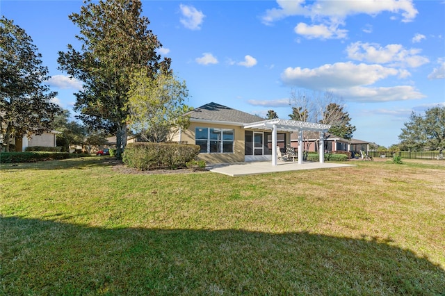 back of property featuring a pergola, a patio, and a yard