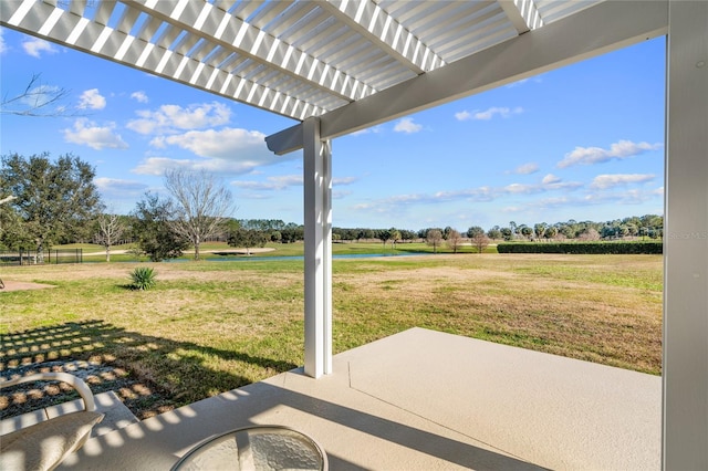 view of patio featuring a pergola and a rural view