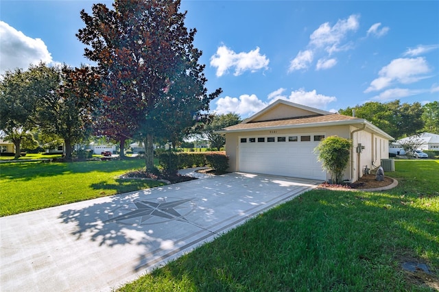 view of property exterior with a lawn, central AC unit, and a garage