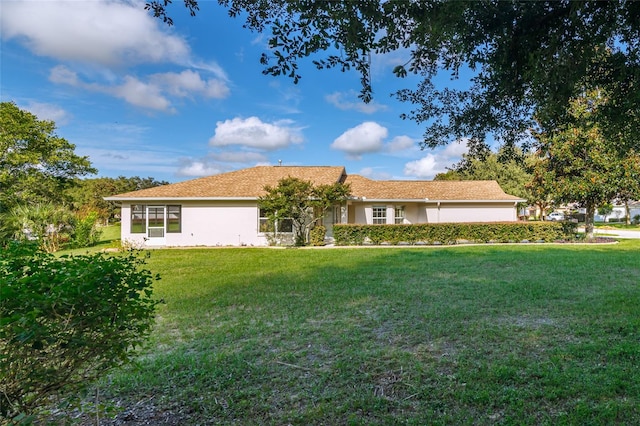 ranch-style house with a front lawn