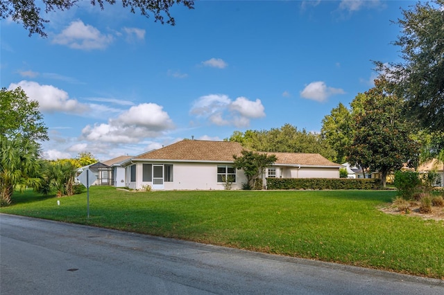 ranch-style home with a front yard