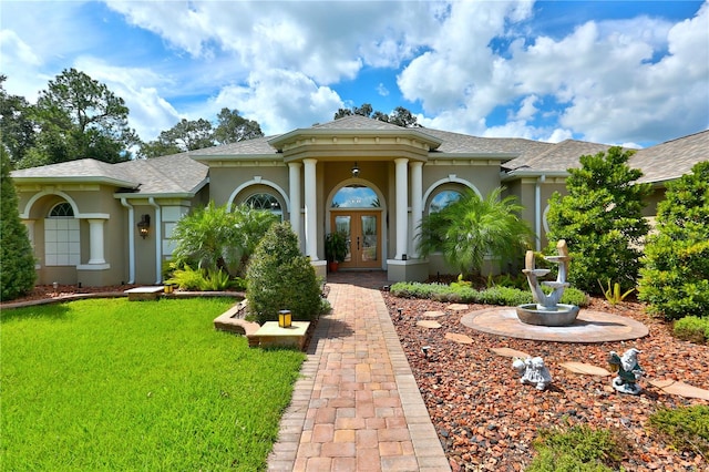 view of front of property featuring french doors and a front yard