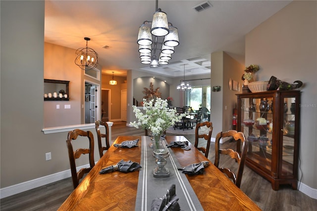 dining room with a notable chandelier and dark hardwood / wood-style flooring