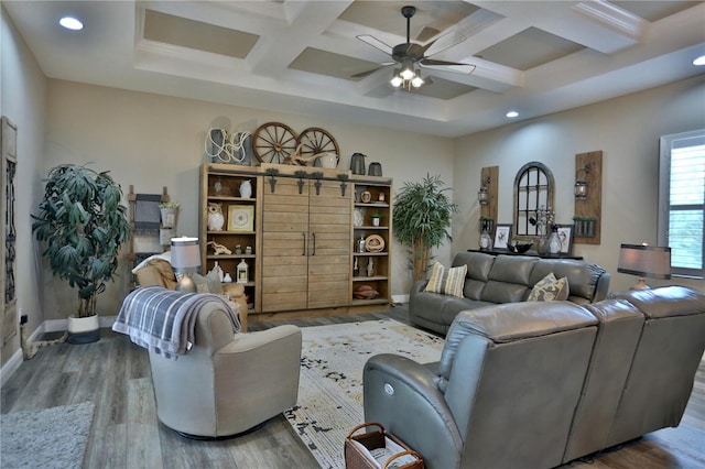 living room with beamed ceiling, coffered ceiling, hardwood / wood-style floors, and ceiling fan