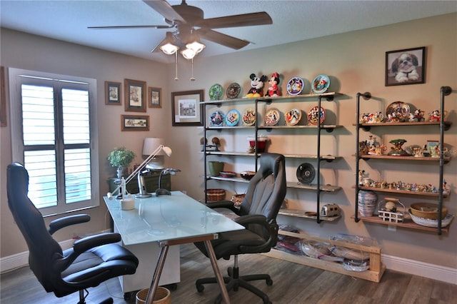 office with ceiling fan and dark wood-type flooring