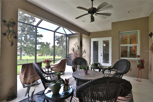 sunroom / solarium with ceiling fan and plenty of natural light