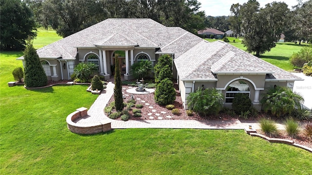 ranch-style home with a front lawn