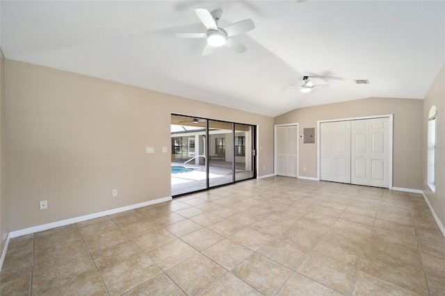 unfurnished bedroom featuring vaulted ceiling, ceiling fan, light tile patterned floors, and access to outside