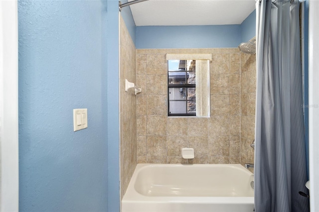 bathroom with shower / bath combo with shower curtain