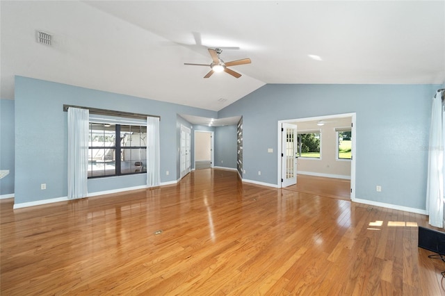 unfurnished living room with vaulted ceiling, ceiling fan, and light hardwood / wood-style floors