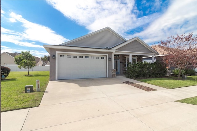 view of front of house with a garage and a front lawn