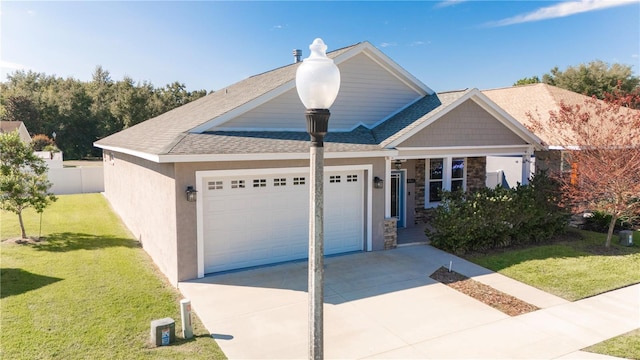 view of front facade featuring a front yard and a garage