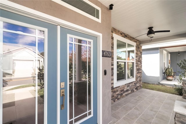 exterior space featuring ceiling fan