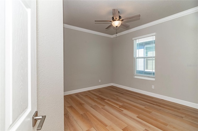 unfurnished room featuring ornamental molding, light hardwood / wood-style floors, and ceiling fan