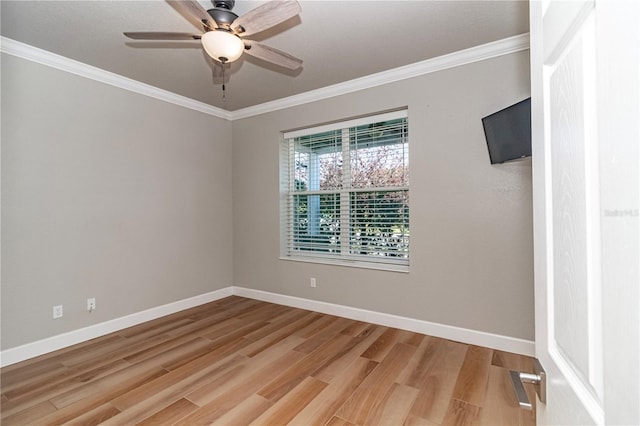 unfurnished room with ceiling fan, hardwood / wood-style flooring, and crown molding