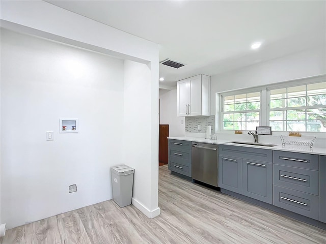 kitchen with white cabinets, sink, gray cabinetry, light hardwood / wood-style flooring, and dishwasher