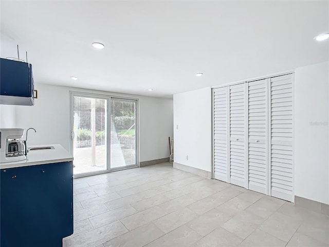 unfurnished living room with sink