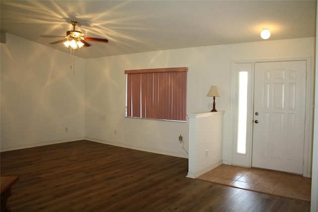 foyer entrance featuring ceiling fan and dark hardwood / wood-style floors