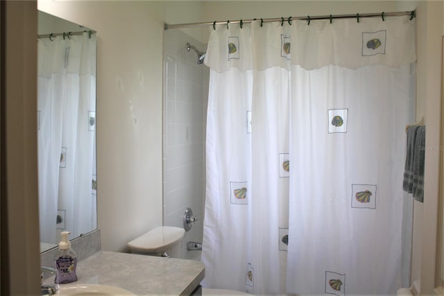 full bathroom featuring shower / tub combo with curtain, vanity, and toilet