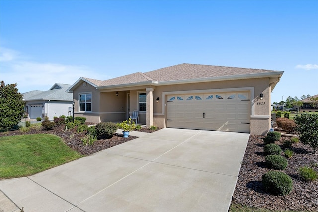 single story home featuring a garage