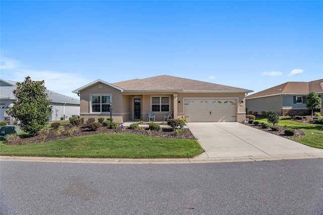 ranch-style home featuring a garage and a front lawn