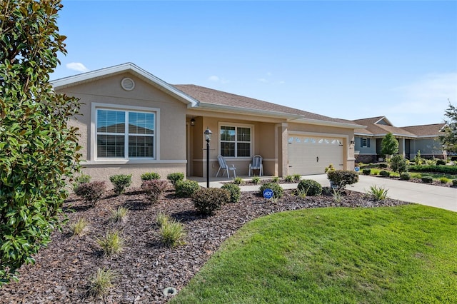 single story home with a garage and a front lawn