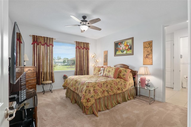 bedroom featuring light carpet and ceiling fan