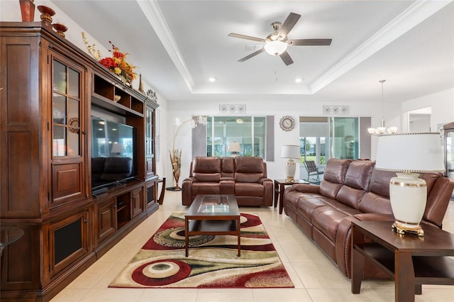 living room featuring a raised ceiling, light tile patterned flooring, ornamental molding, and ceiling fan with notable chandelier