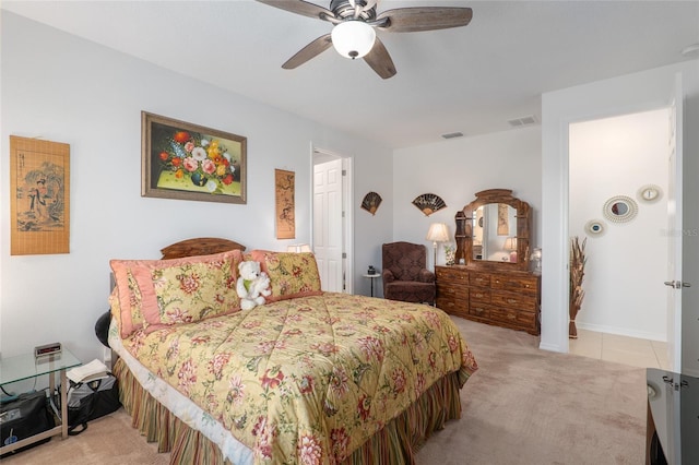 bedroom with ceiling fan and light colored carpet