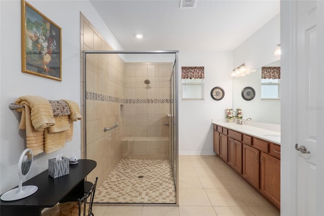 bathroom featuring vanity, an enclosed shower, and tile patterned flooring