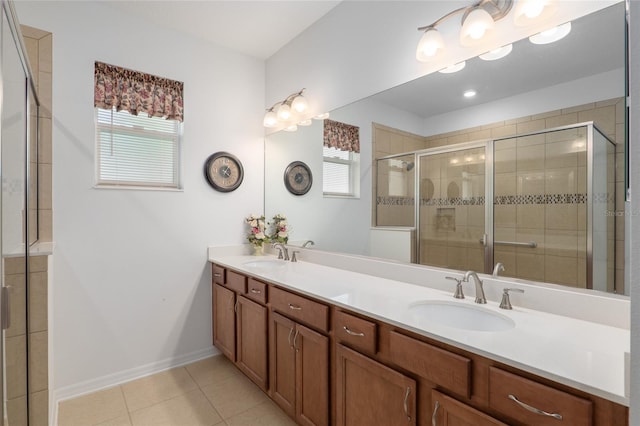 bathroom featuring tile patterned flooring, vanity, and walk in shower