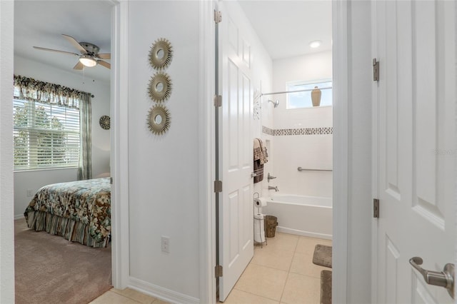 bathroom with ceiling fan, shower / tub combination, tile patterned floors, and a wealth of natural light