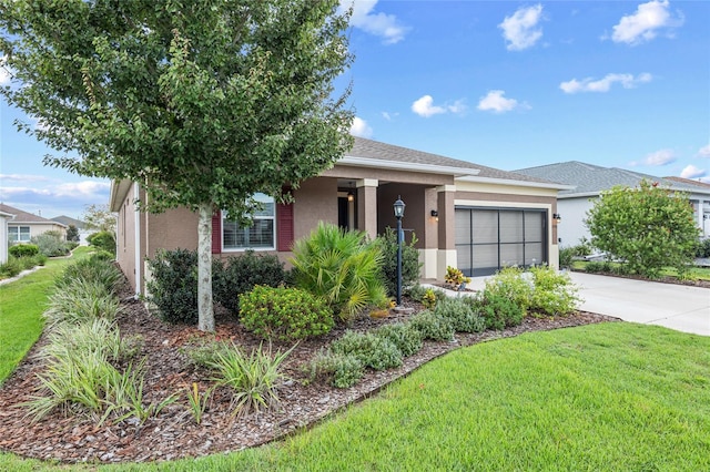 7709 SW 86th Ct, Ocala, FL 34481 - view of front of property with stucco siding, driveway, an attached garage, and a front lawn