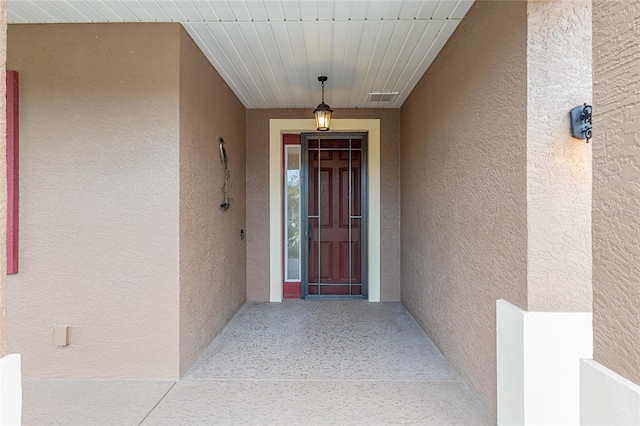 7709 SW 86th Ct, Ocala, FL 34481 - view of exterior entry featuring stucco siding