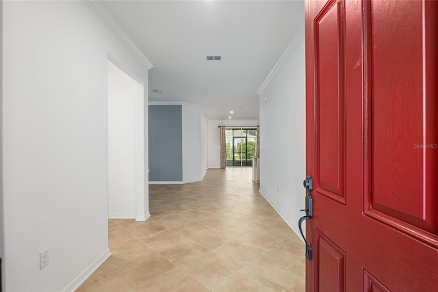 entryway featuring ornamental molding