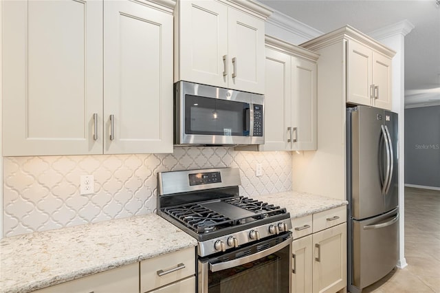 7709 SW 86th Ct, Ocala, FL 34481 - kitchen featuring appliances with stainless steel finishes, ornamental molding, decorative backsplash, and light stone counters