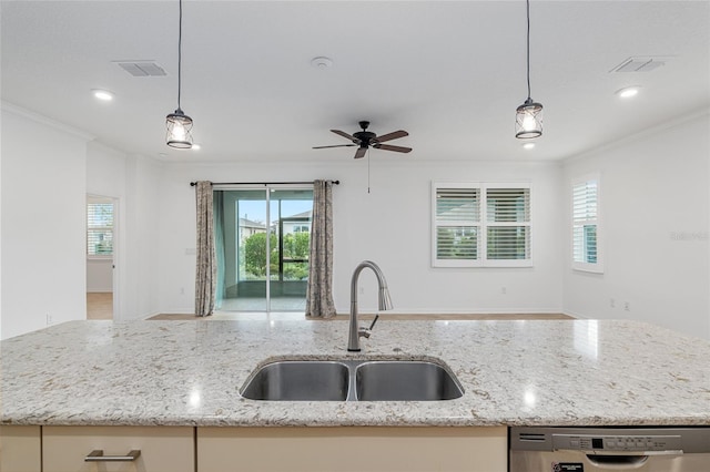 kitchen with pendant lighting, light stone countertops, sink, and stainless steel dishwasher