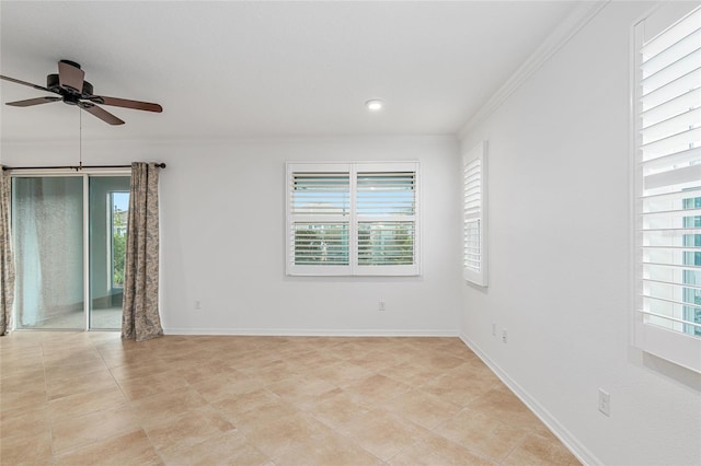 spare room with ornamental molding, ceiling fan, and plenty of natural light