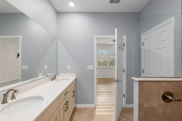 bathroom with ceiling fan, vanity, and tile patterned flooring