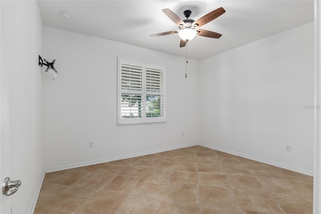 unfurnished room featuring ceiling fan and light tile patterned flooring