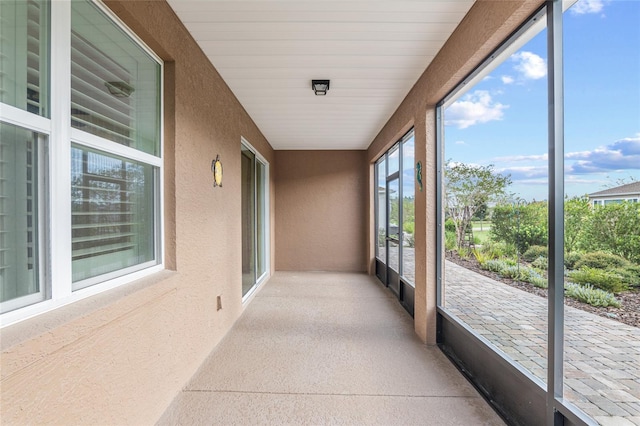 unfurnished sunroom with plenty of natural light