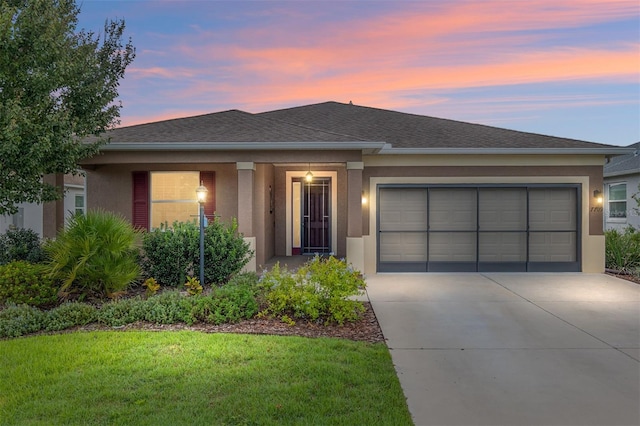 7709 SW 86th Ct, Ocala, FL 34481 - view of front of property featuring concrete driveway, a garage, stucco siding, a yard, and a shingled roof