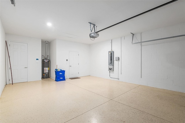7709 SW 86th Ct, Ocala, FL 34481 - garage featuring water heater, concrete block wall, a garage door opener, and electric panel