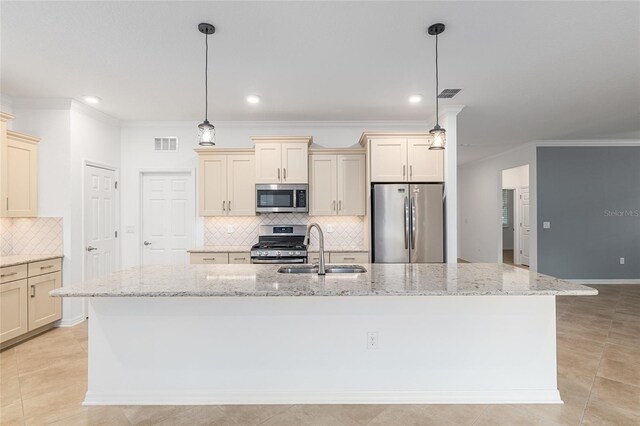 7709 SW 86th Ct, Ocala, FL 34481 - kitchen with appliances with stainless steel finishes, a sink, cream cabinetry, backsplash, and crown molding
