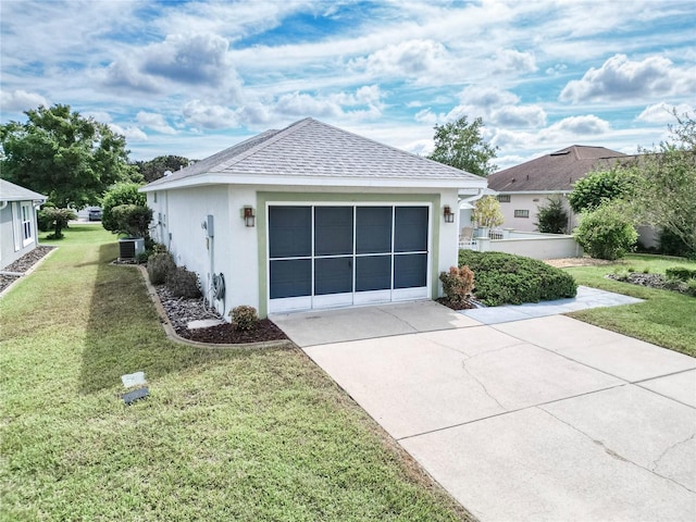 view of home's exterior with a yard, cooling unit, and a garage