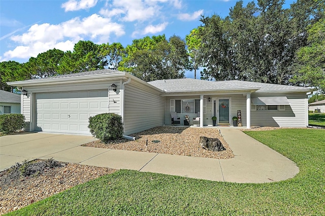 ranch-style home featuring a garage and a front lawn