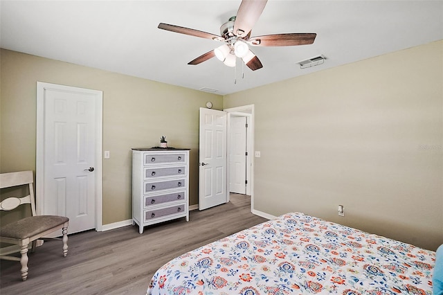 bedroom with ceiling fan and hardwood / wood-style flooring