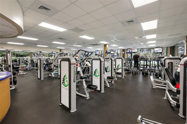 exercise room featuring a paneled ceiling