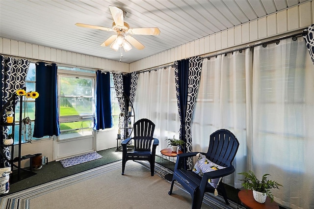 sitting room featuring carpet floors and ceiling fan