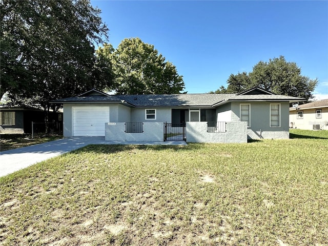 ranch-style house with a garage and a front yard